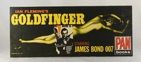 Goldfinger | Pan | Movie. Shop display board.  Part of the marketing campaign.