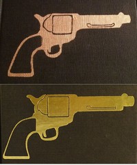 The Man With The Golden Gun with fake gun stamped on the cover