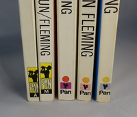 Spines of the Pan white series, ones on the right show fading